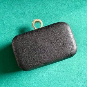 NEW condition, black clutch